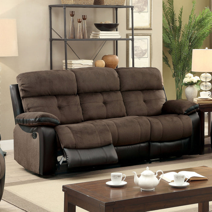 Right angled transitional brown with black faux leather recliner sofa in a living room with accessories