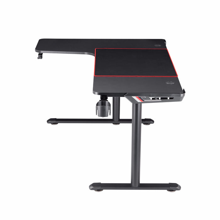 Front-facing side view contemporary black L-shaped gaming desk with mouse pad on a white background