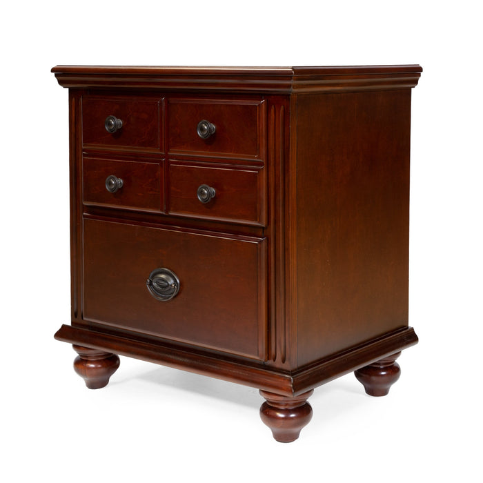 Left-angled traditional cherry nightstand against a white background. The top drawer features a four-panel knob design, while the lower drawer is accessorized with a ring pull.