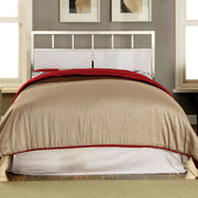 Front-facing modern glam white and chrome bed with wave headboard details and linens in a contemporary bedroom