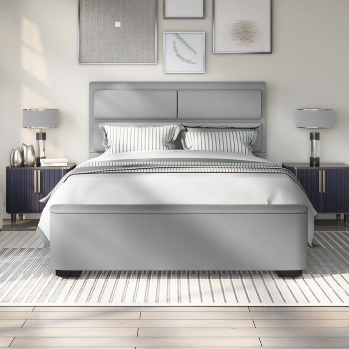Front-facing modern glam gray upholstered bed with head and footboard storage and linens in a stylish bedroom