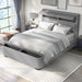 Left-angled top view of a modern glam gray upholstered bed in a stylish bedroom with linens and accessories
