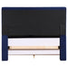 Front-facing back view of a modern glam navy blue upholstered bed on a white background