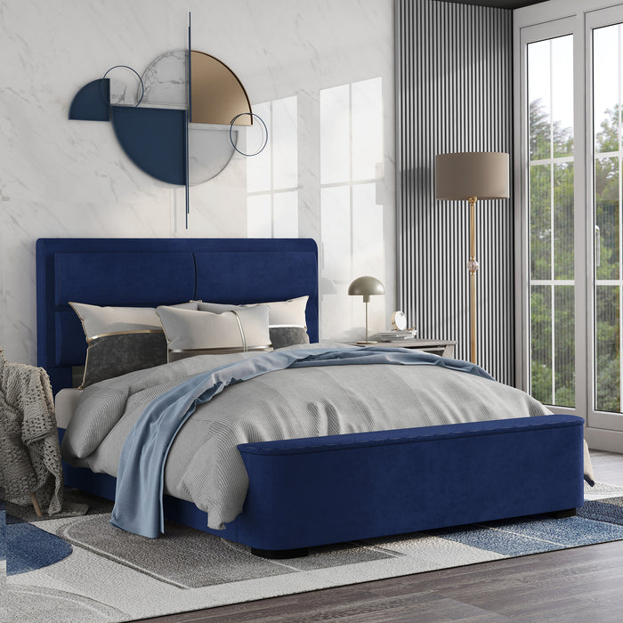 Right-angled modern glam navy blue upholstered bed in a stylish bedroom with linens and accessories