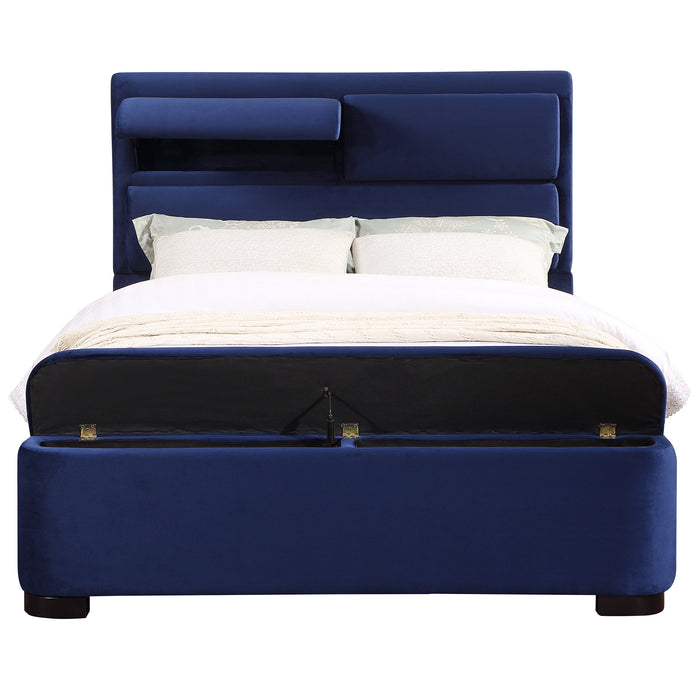 Front-facing modern glam navy blue upholstered bed with head and footboard storage and linens on a white background