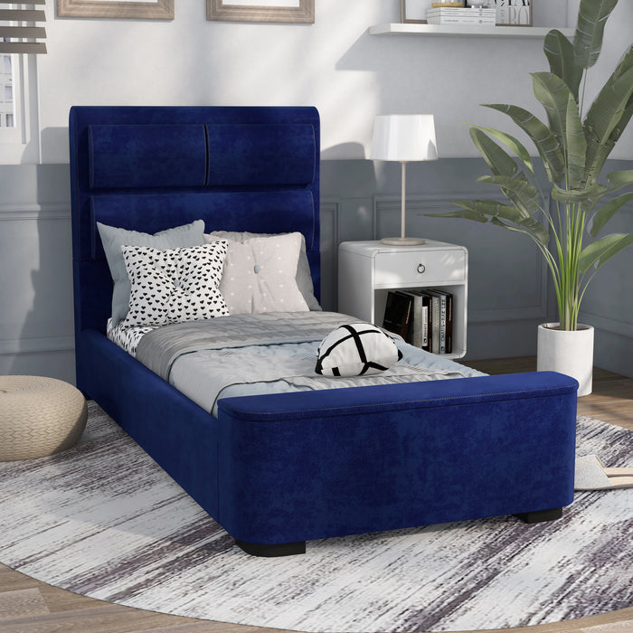Right-angled modern glam navy blue upholstered bed in a stylish bedroom with linens and accessories