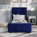 Front-facing modern glam navy blue upholstered bed with linens in stylish bedroom.