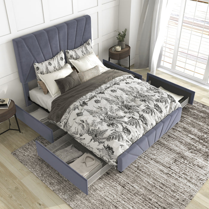 Right-angled top-down view of modern glam gray upholstered storage bed with radiant channel tufting and underbed drawers pulled out in a stylish bedroom with linens and accessories