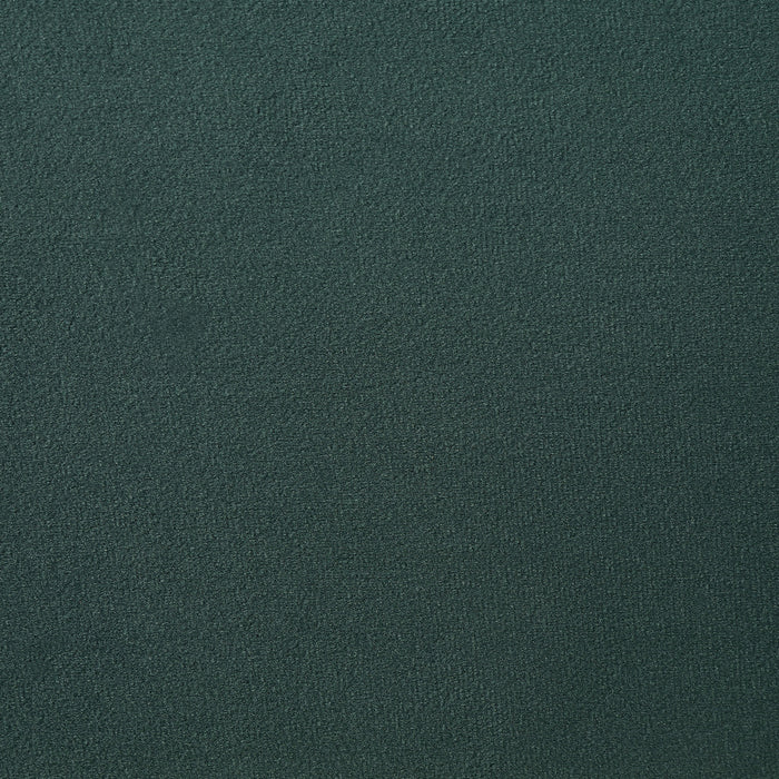 Swatch of velvet-like dark green fabric of a modern glam upholstered storage bed