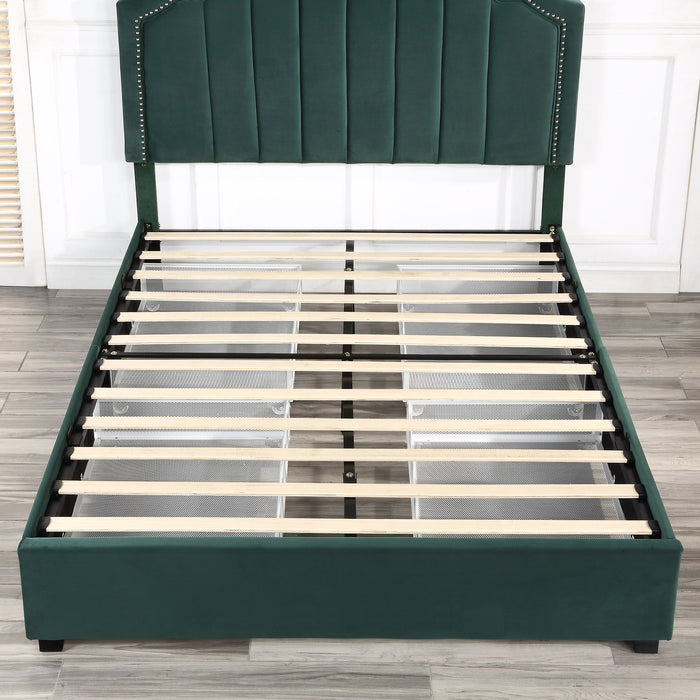 Front-facing top-down view of a modern glam dark green upholstered storage bed with nailhead trim and underbed storage drawers with no mattress in an empty bedroom