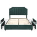 Front-facing modern glam dark green upholstered storage bed with nailhead trim and underbed storage drawers extended with no mattress on a white background