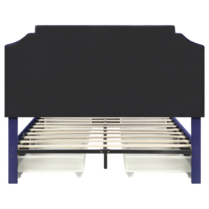 Front-facing back view of a modern glam navy blue upholstered storage bed with nailhead trim and underbed drawers on a white background