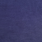 Swatch of velvet-like navy blue fabric of a modern glam upholstered storage bed
