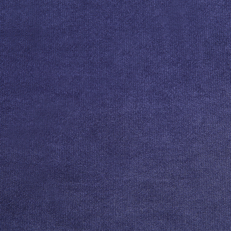 Swatch of velvet-like navy blue fabric of a modern glam upholstered storage bed