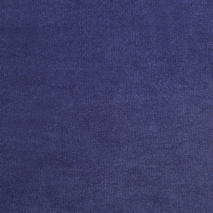 Swatch of velvet-like navy blue fabric of a modern glam upholstered storage bed