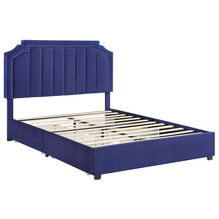 Right-angled modern glam navy blue upholstered storage bed with nailhead trim and underbed drawers on a white background
