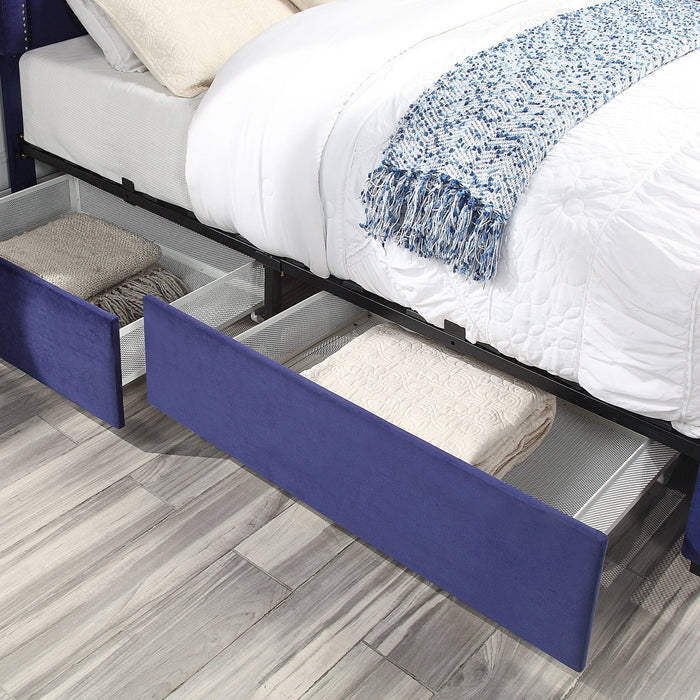 Right-angled close-up of underbed storage drawers of a modern glam navy blue upholstered storage bed with nailhead trim in a stylish bedroom with linens and accessories