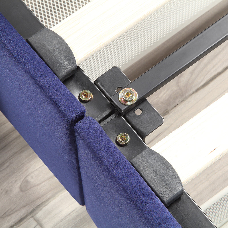 Left-angled close-up frame and underbed drawer detail view of a modern glam navy blue upholstered storage bed with nailhead trim on a woodgrain floor
