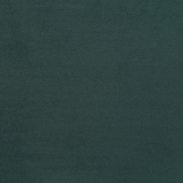 Swatch of velvet-like dark green fabric of a modern glam upholstered storage bed