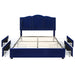 Front-facing modern glam navy blue upholstered storage bed with panel-style nailhead trim and underbed drawers extended on a white background