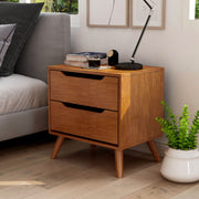 Left-angled oak finished mid-century modern style nightstand against a white background. Two drawers with grooved handles sit on tapered and splayed feet.