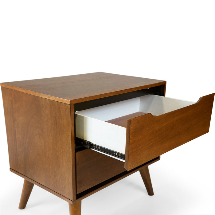 Right-angled oak finished mid-century modern style nightstand against a white background. The top drawer opens on a full extension metal glide to reveal its felt-lining.