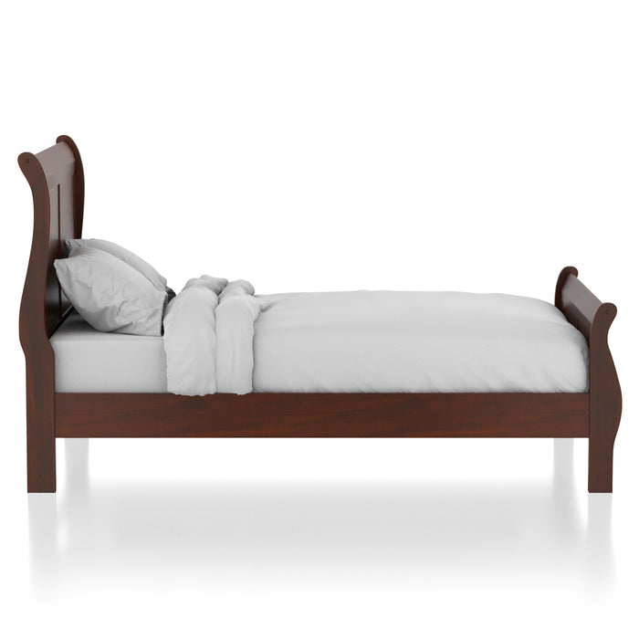 Front-facing side view of a transitional cherry finish wooden sleigh bed with linens on a white background