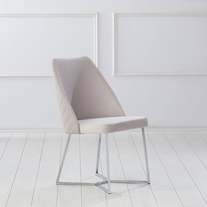 Right-angled modern glam white microfiber dining chair with a geometric base in an empty room