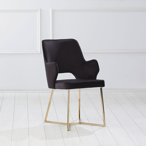 Right-angled modern glam black microfiber dining armchair with a geometric base in an empty room