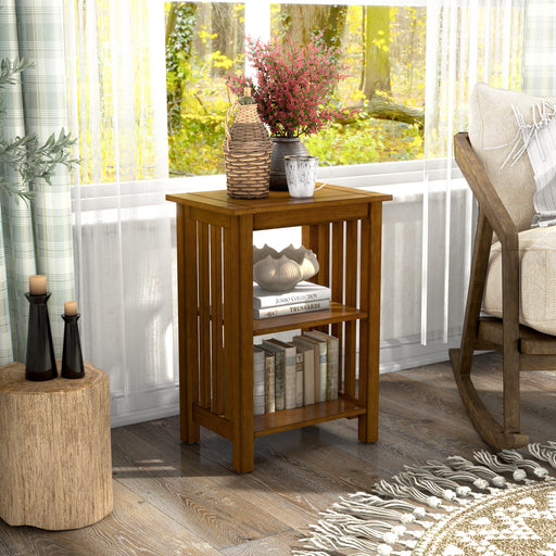 Right-angled mission style solid wood two-shelf end table in antique oak in a living room with accessories