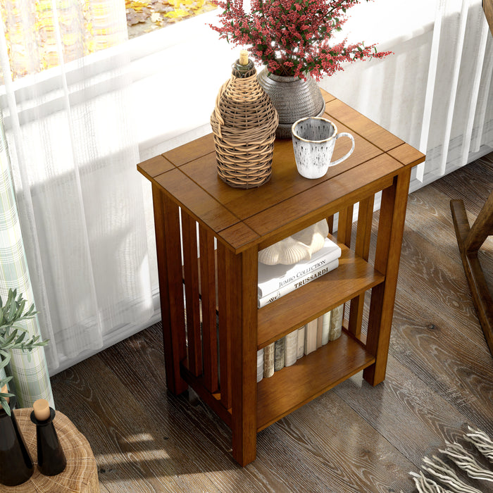 Top close up mission style solid wood two-shelf end table in antique oak in a living room with accessories
