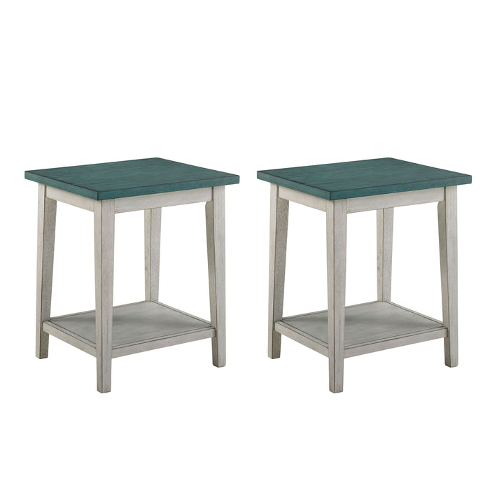 Right angled contemporary two-tone wood side tables on a white background. Light green plank style tabletops rest on white bases with open bottom shelves for a coastal vibe and ample storage space.
