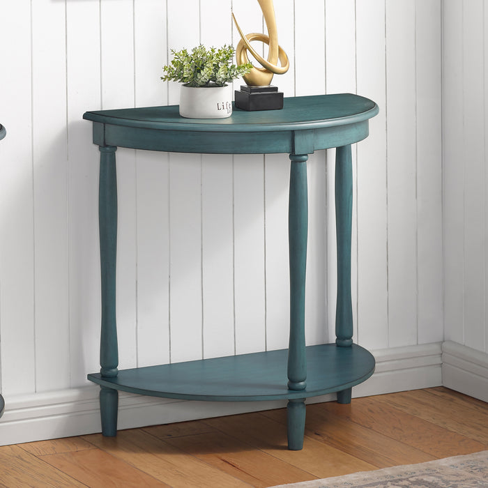 Right-angled demi-lune accent table in an antique green finish with turned legs in a casual living space with accessories