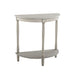 Right-angled demi-lune accent table in an antique white finish with turned legs on a white background