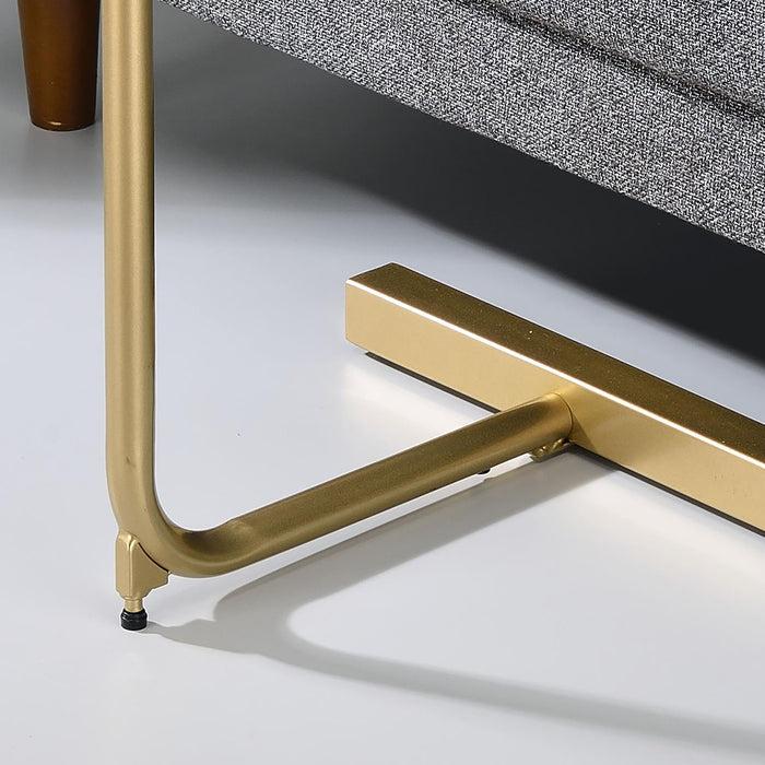 Right angled close up contemporary black and gold C-shaped side table base detail in a living room with accessories