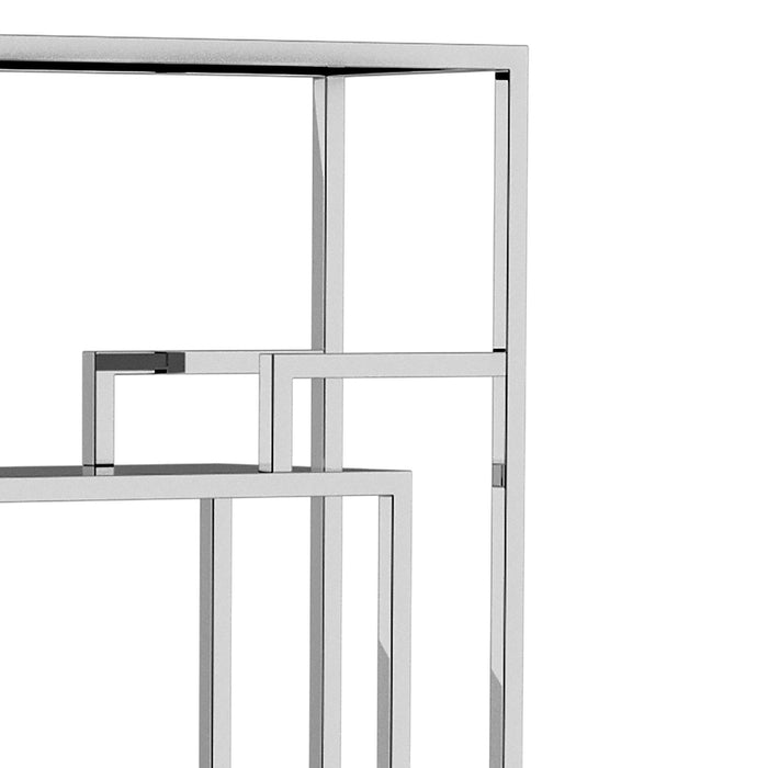 Right-angled close up modern glam geometric etagere bookcase in chrome upper right shelf and geometric detail on a white background