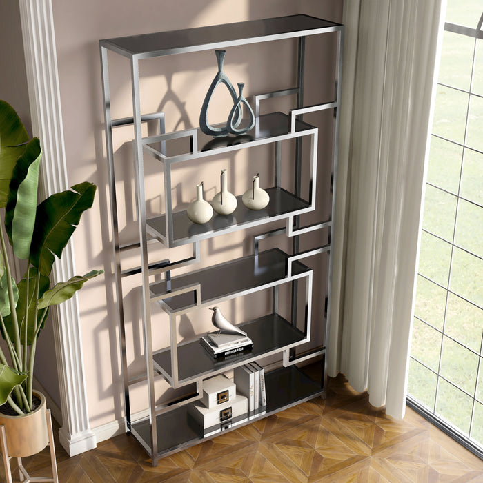 Angled right-facing modern glam geometric etagere bookcase in chrome with five shelves in a contemporary living area with accessories