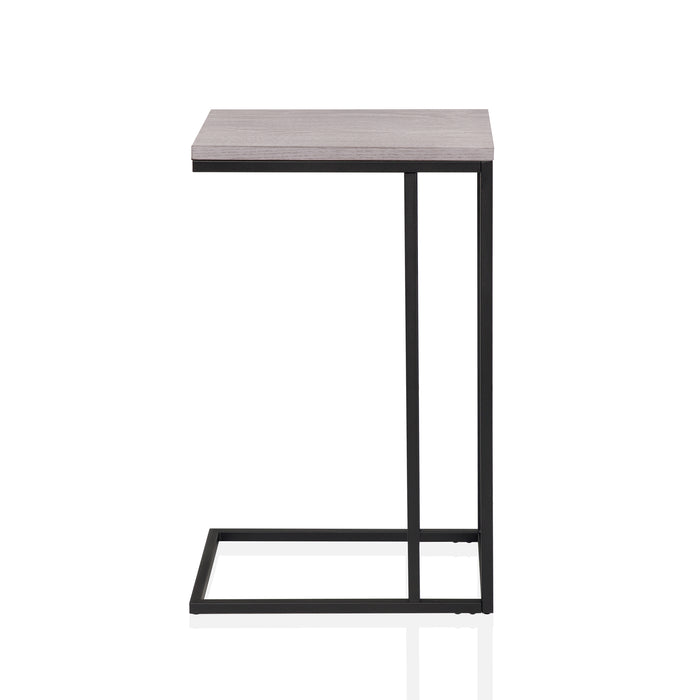 Front-facing side view of a urban black and antique white C-shaped rectangular side table on a white background