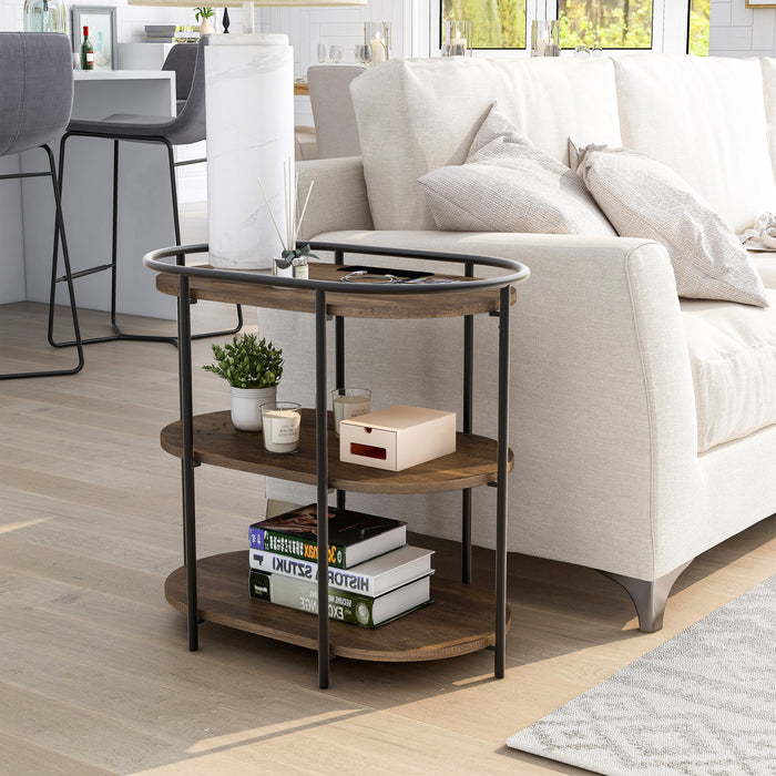 Left angled urban oval three-tier side table with power outlets and USB ports in a living room with accessories