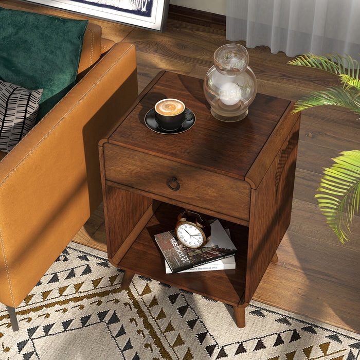 Left angled top-down mid-century modern dark oak side table with single drawer and open bottom cabinet space decorated next to a sofa in a living room.