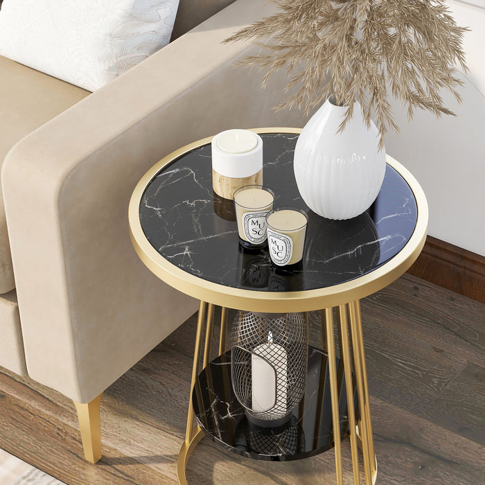 Left angled top-down close up of modern glam round side table with slim gold steel frame and glossy black tabletop detail next to a sofa.