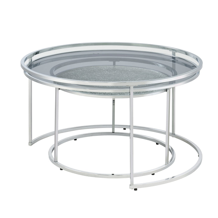 Left angled glam chrome and gray glass two-piece nesting tables, shown nested, on a white background