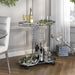 Silver and glass serving cart in a classy dining room. An advent candle display sits on its top shelf, while champagne and wine bottles are secured in the bottle rings of the bottom shelf.