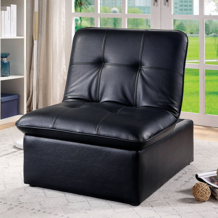 Left angled contemporary black futon chair with biscuit tufting in a living area with accessories