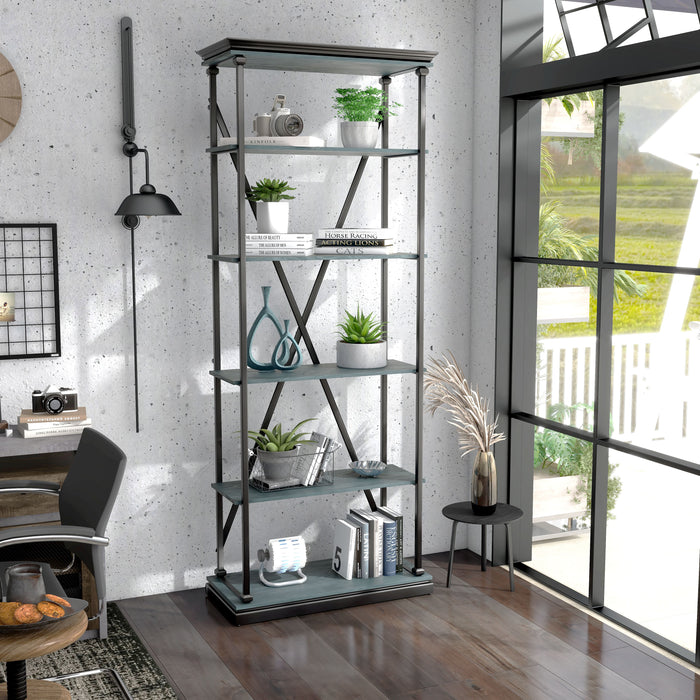Right angled industrial antique blue and black five-shelf bookcase in a sitting area with accessories