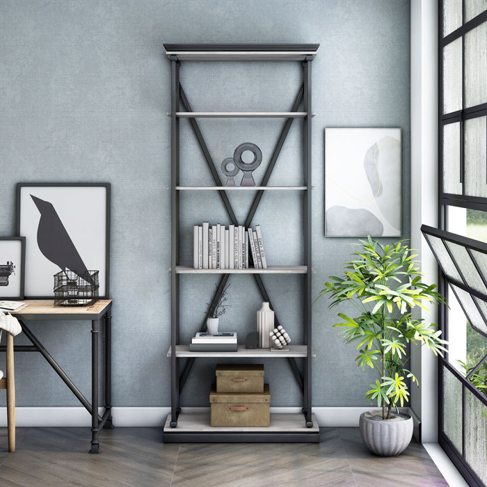 Front-facing industrial antique white and black five-shelf bookcase in a sitting area with accessories