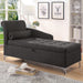 Left angled contemporary gray storage chaise with button tufting in a living room with accessories