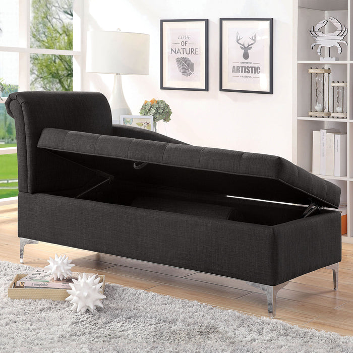 Left angled contemporary gray storage chaise with button tufting and seat lifted in a living room with accessories