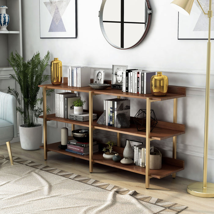 Left angled contemporary three-shelf light walnut and gold bookcase in a living room with accessories