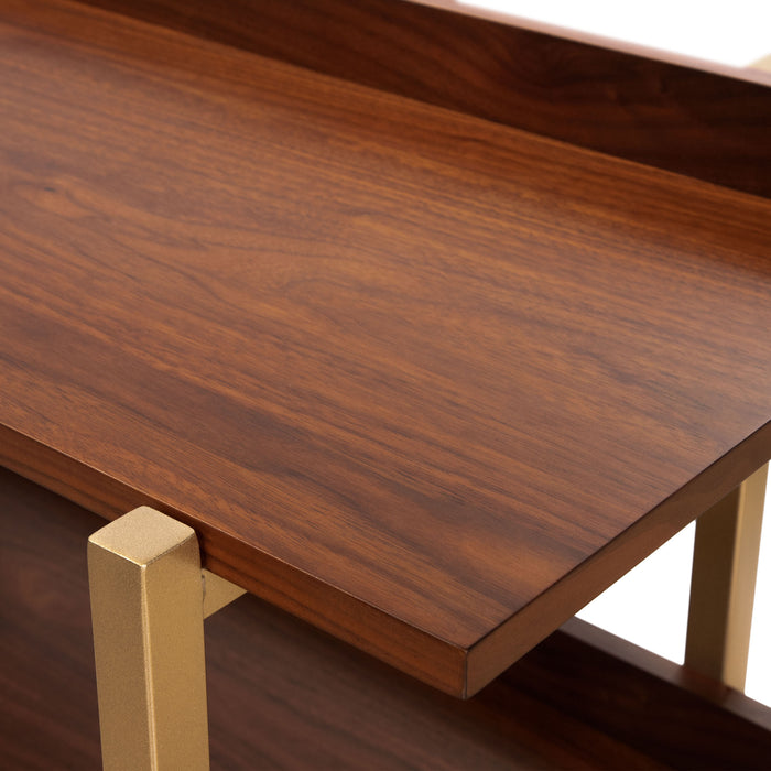 Left angled close up top front corner shelf detail of a contemporary three-shelf light walnut and gold bookcase on a white background